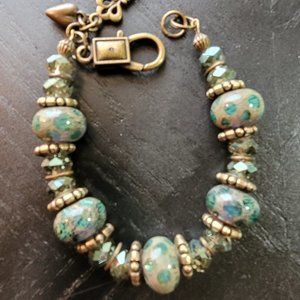 Antique Gold Bracelet with Glass and Crystal Beads with Gold Tone Spacers.